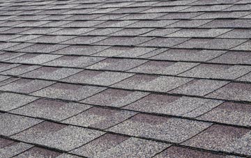 Climping tiles for shallow pitch roofing